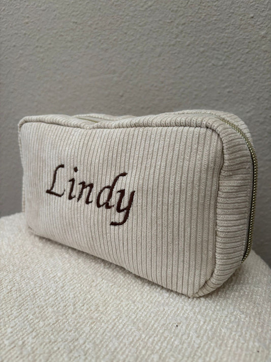 Toilettas geborduurd